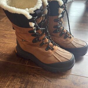 Women's Ugg Meridian Tall 7.5 fits like 8